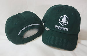 Two hats - one is positioned to show the back of the hat and the other shows the front. The back of the hat says "People powered wilderness preservation." The front has a logo of the Wilderness Committee. End of image description.